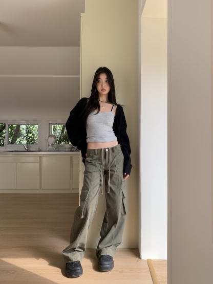 Vintage low-rise cargo pants with multiple pockets and a wide, straight leg.