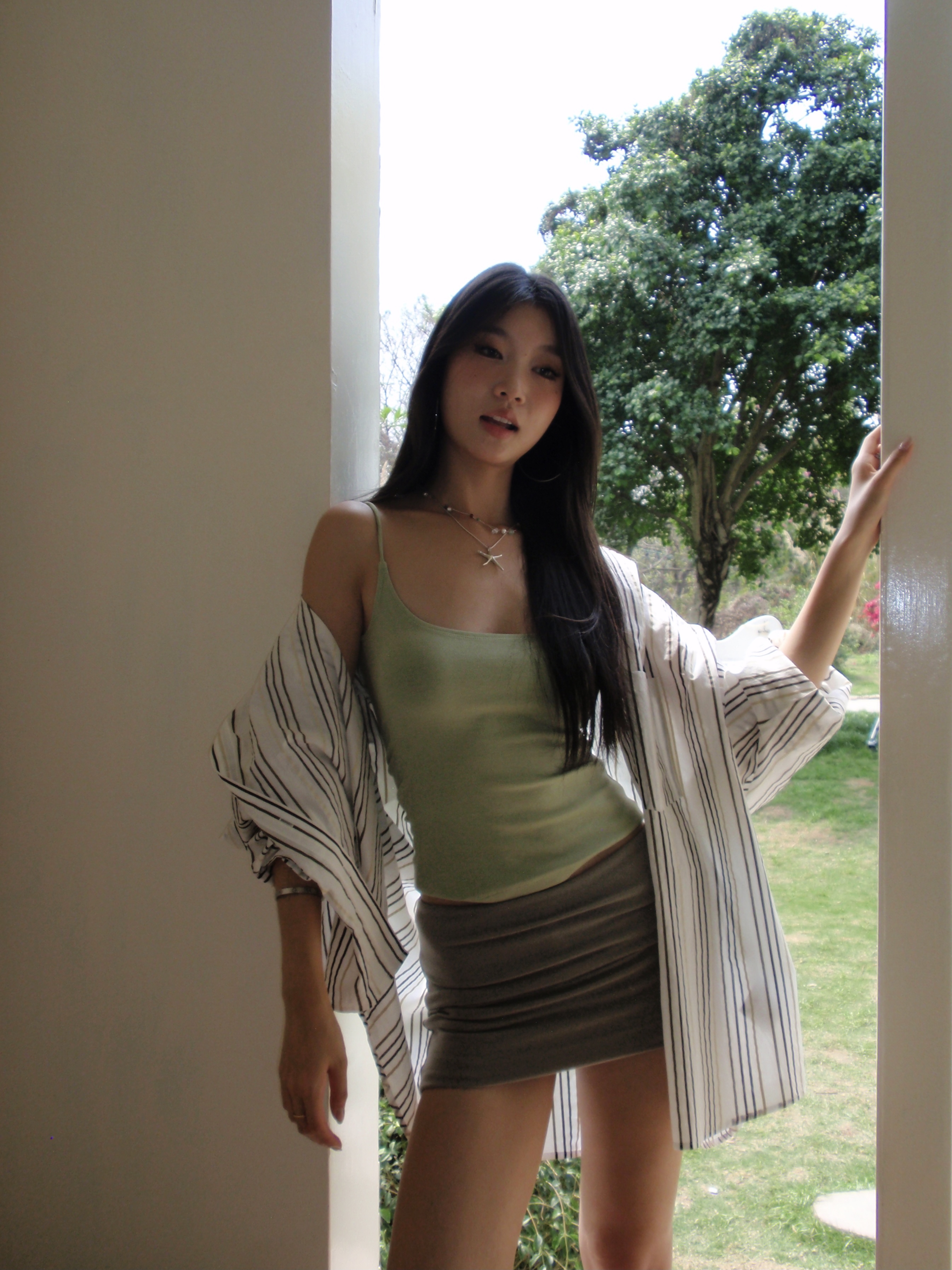 Green spaghetti strap top in a sexy style. Wear it as an inner shirt or wear it alone and it will look good.
