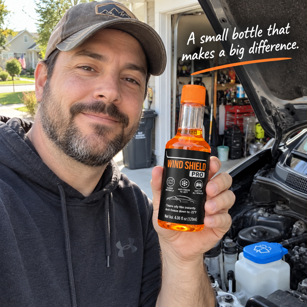 Customer using windshield cleaner fluid bottle in car garage
