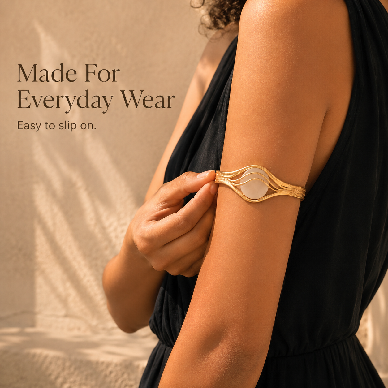 Woman styling gold CGM bracelet