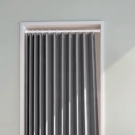 Pleated doorway curtain installed in an indoor opening