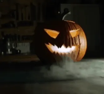 Ultrasonic mist maker creating illuminated Halloween fog