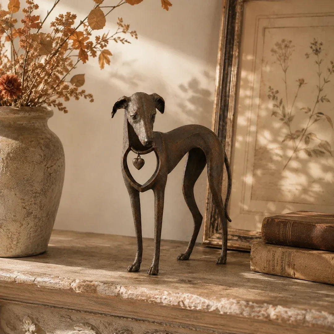 Vintage dog sculpture styled on a console table