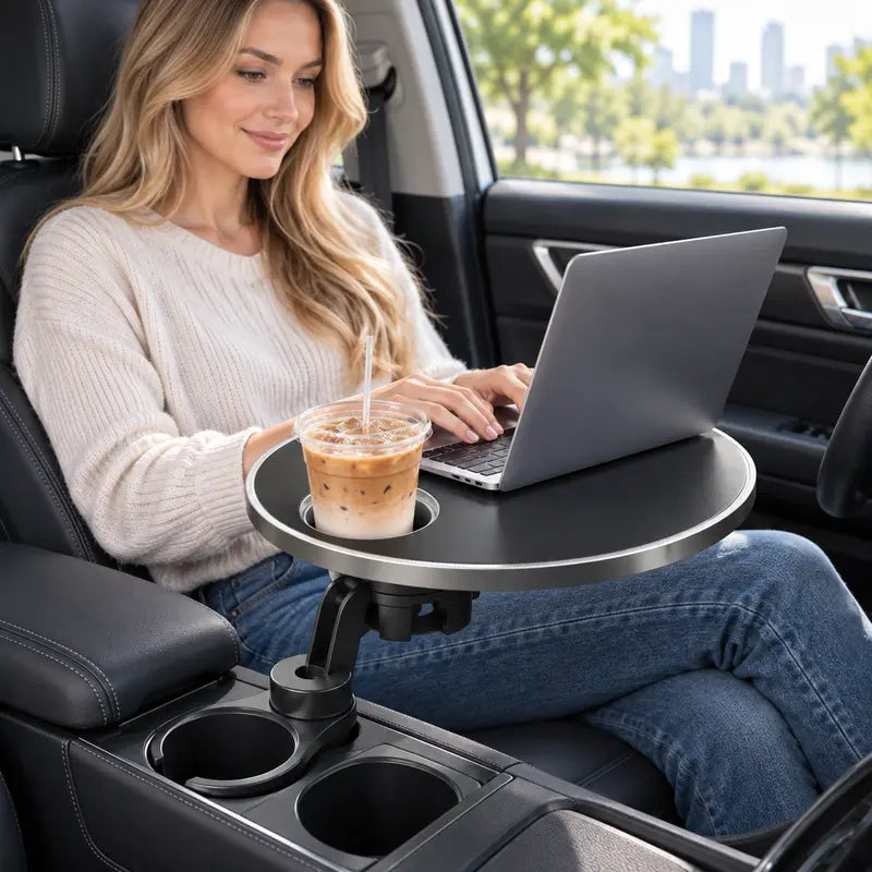 Car tray supporting a compact laptop while the vehicle is parked