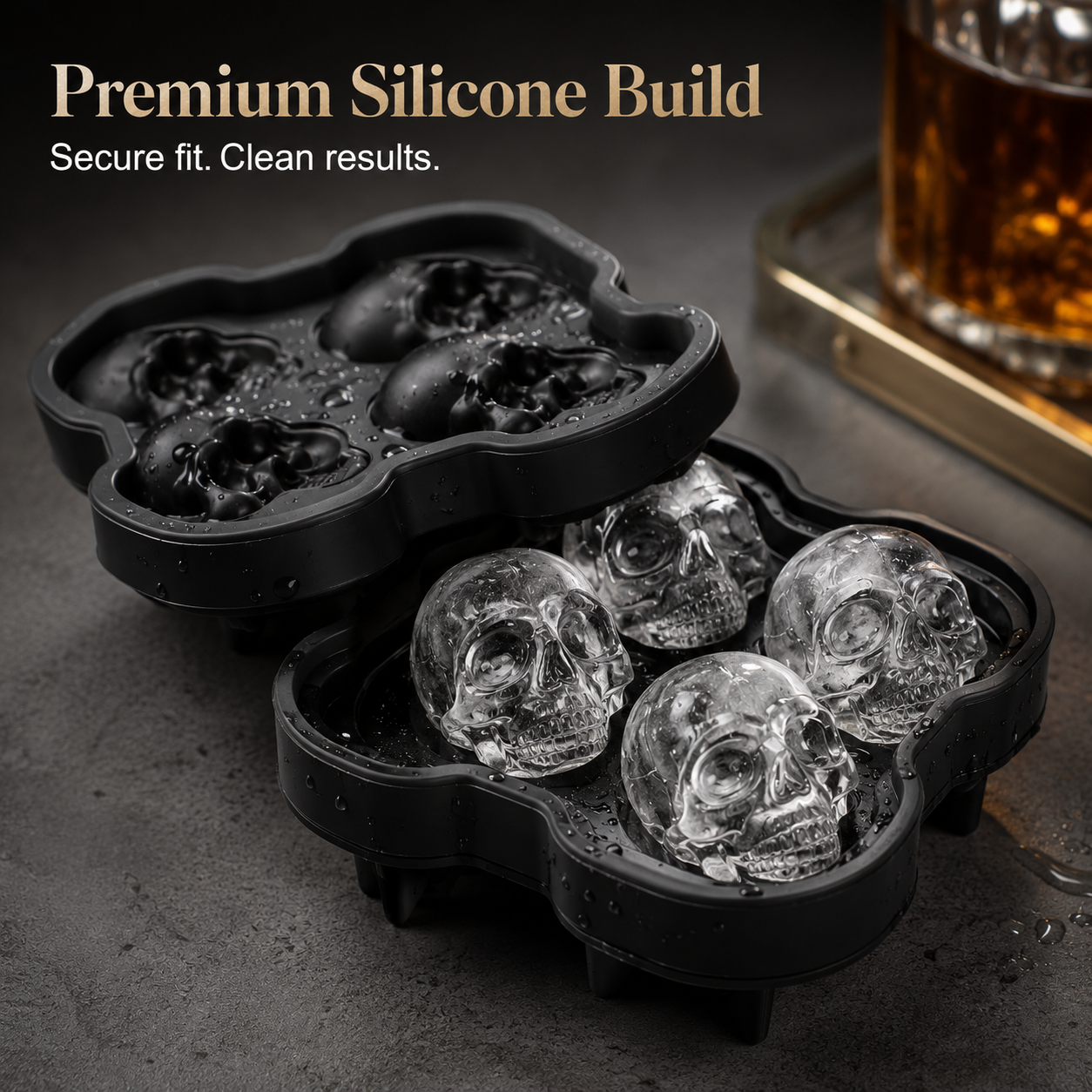 Clear skull ice cube melting slowly in golden whiskey drink close up