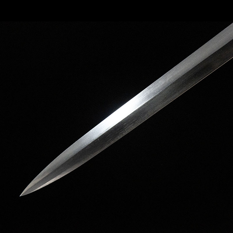 Detailed view of the sharp point of a 65 Manganese Steel rapier blade.