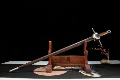 Side profile of a 65 Manganese Steel rapier resting on a decorative display stand.