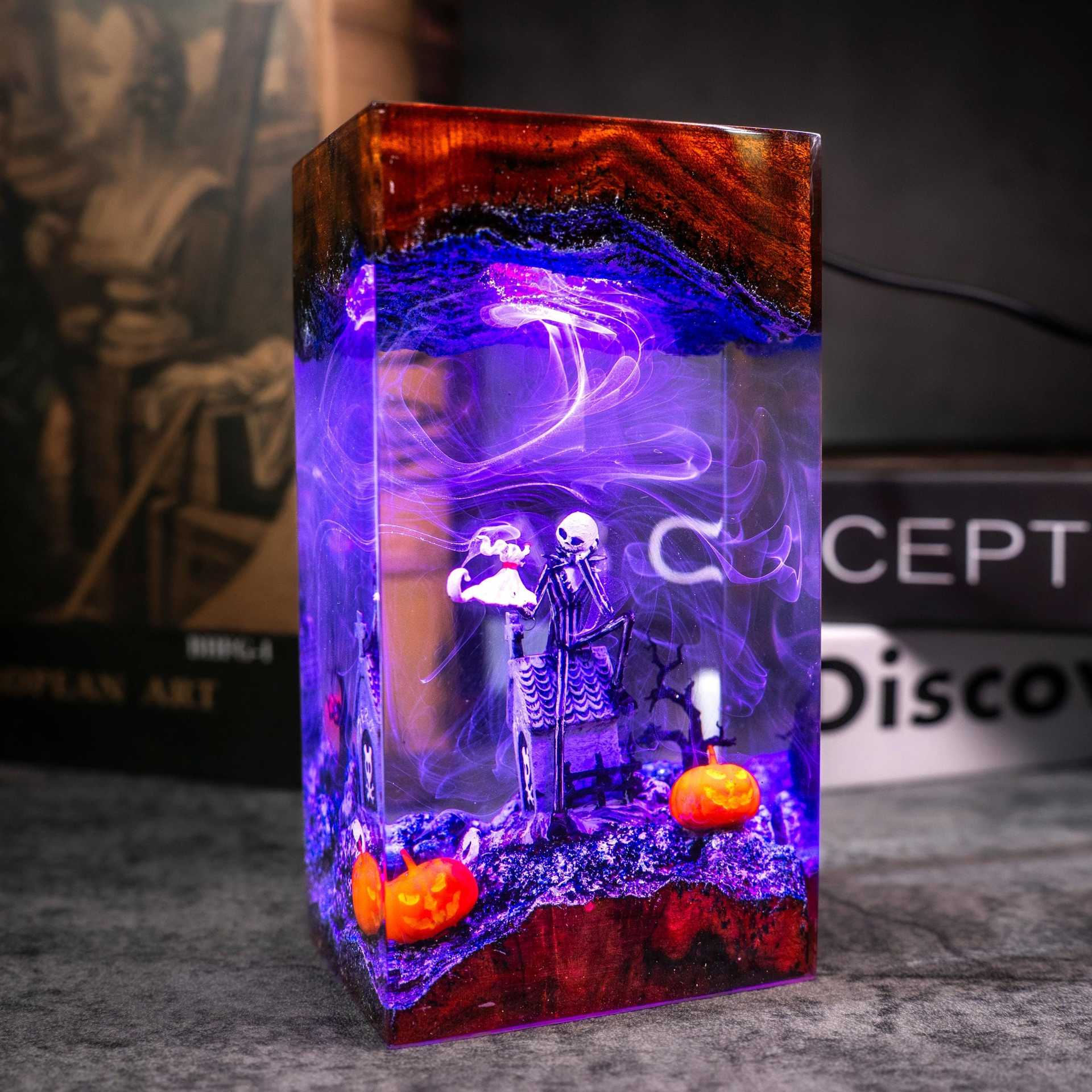 Glowing Halloween resin diorama lamp with purple light and pumpkin accents