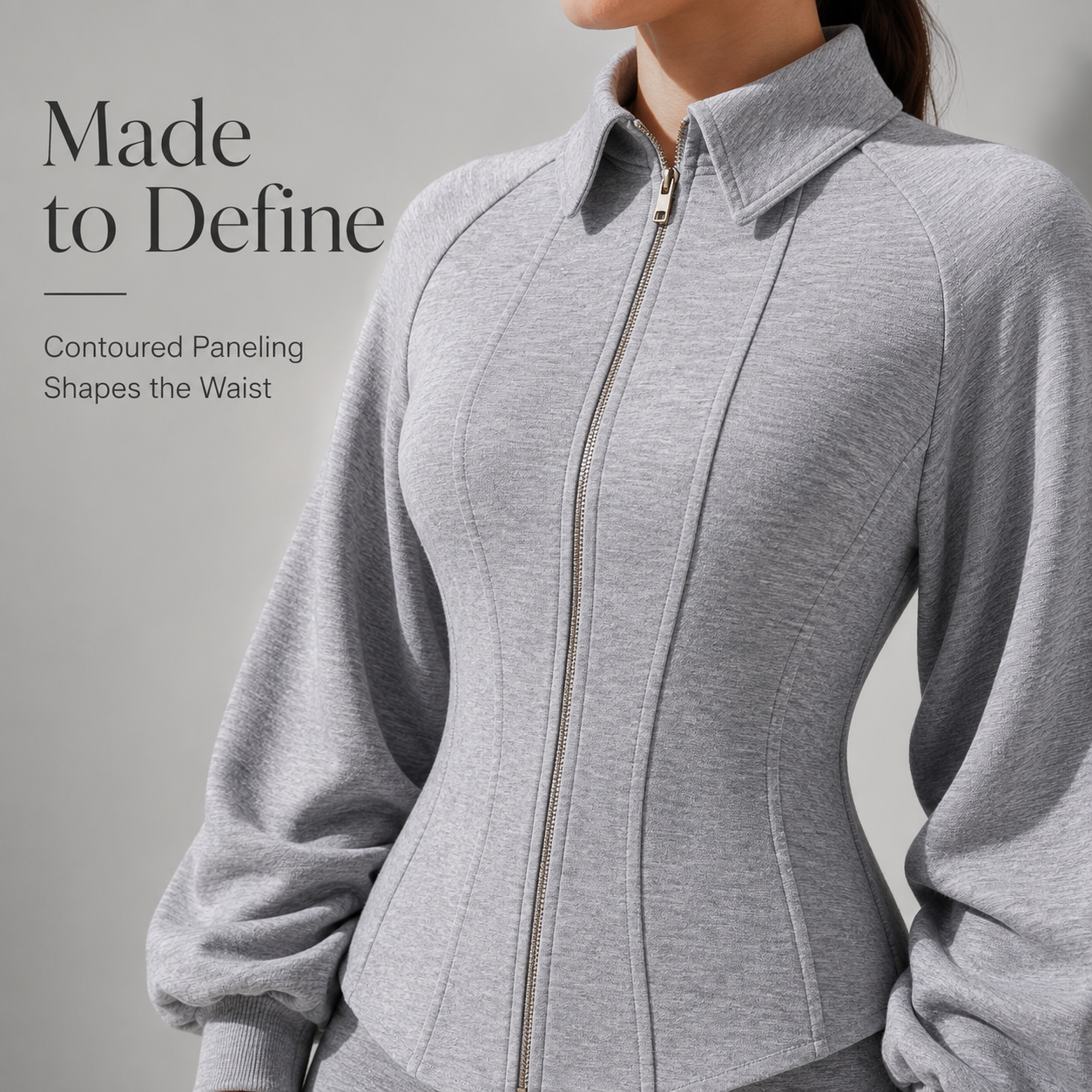 Sculpted grey zip jacket front view showing waist paneling