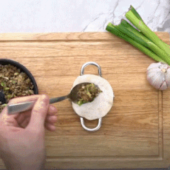 Stainless steel dumpling maker in use