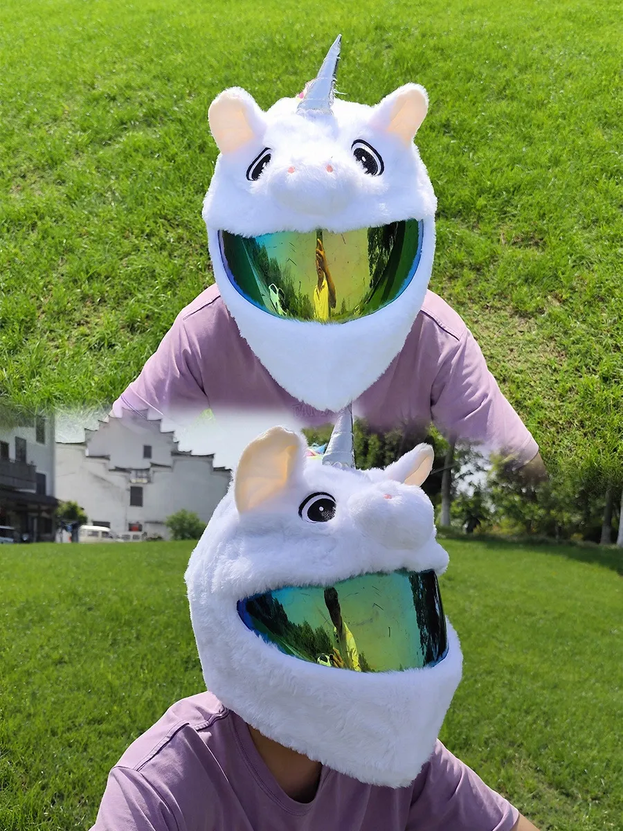 Close-up of the cute and fluffy white Unicorn helmet cover showing the ears and big eyes.