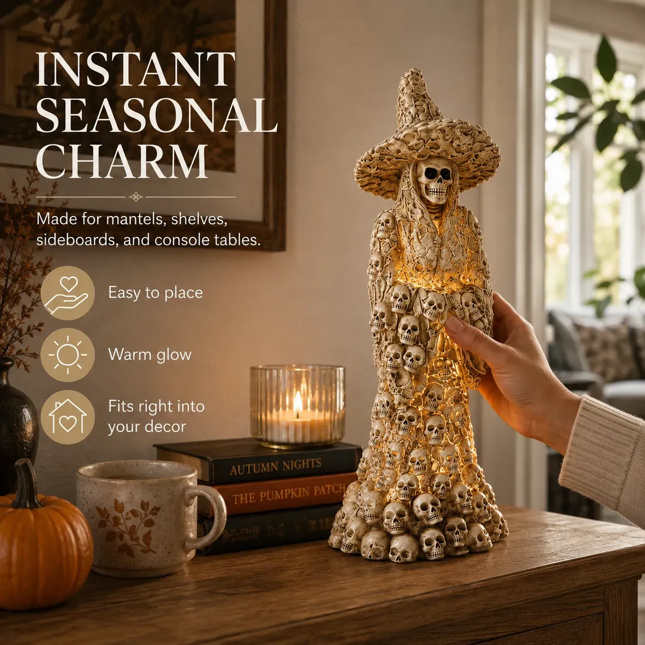 Glowing witch statue displayed with fall decorations
