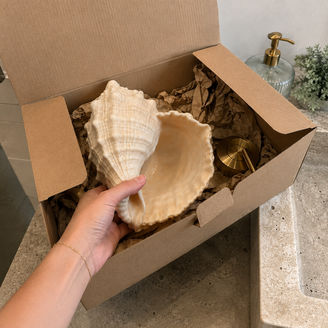 Seashell faucet being unpacked from protective packaging