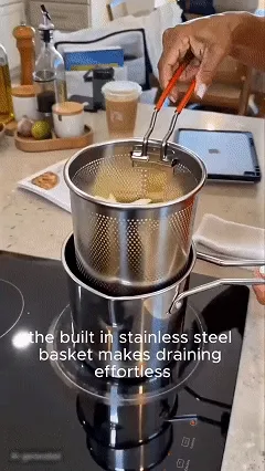 Compact stainless steel deep fryer pot in use