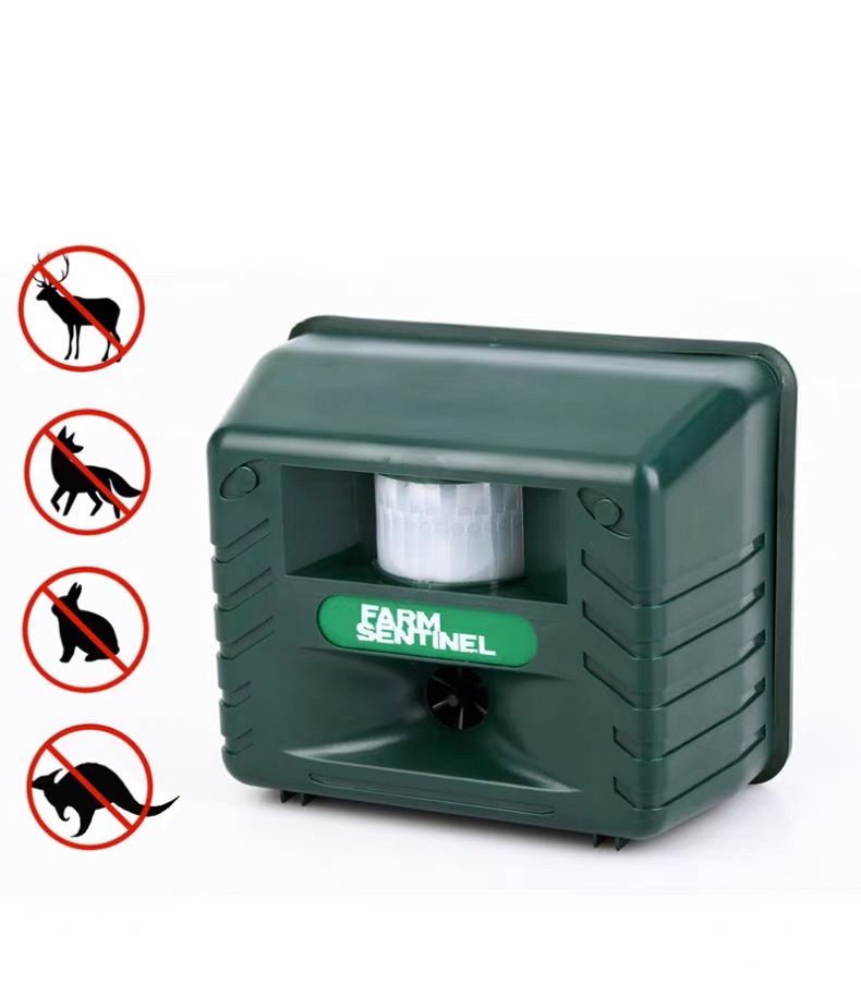 Farm Sentinel ultrasonic woodpecker and bird repeller device with icons showing protection against deer, foxes, rabbits, and pests.