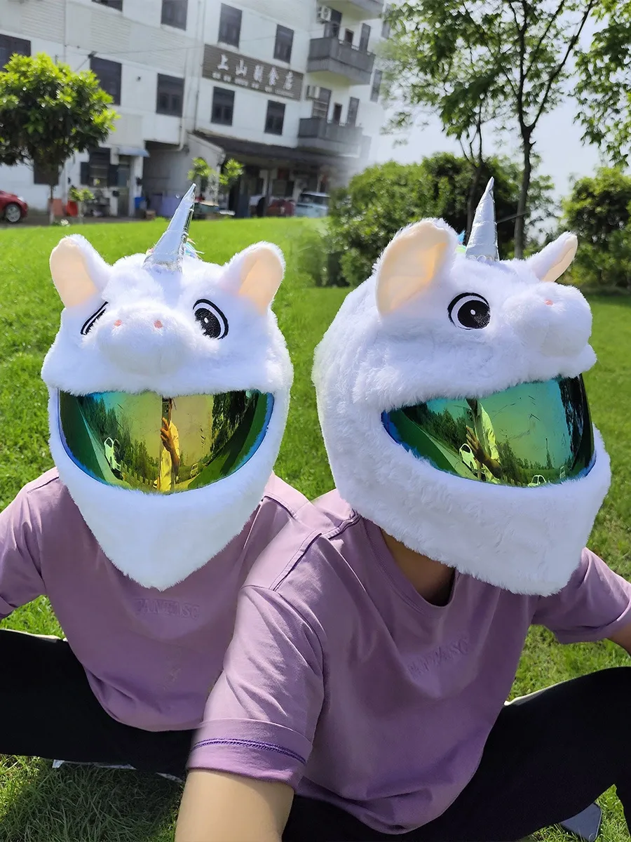 Two riders wearing fluffy Unicorn full-face motorcycle helmet covers side-by-side, perfect for couple rides.