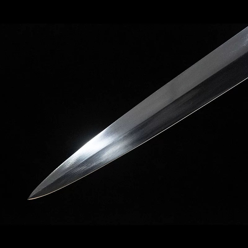 Close-up of the sharp, hand-forged 65 manganese steel blade tip of the medieval longsword.