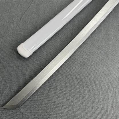 Close-up of the sharp Kissaki tip and white scabbard of the Kuchiki Unleashed 1045 carbon steel katana.