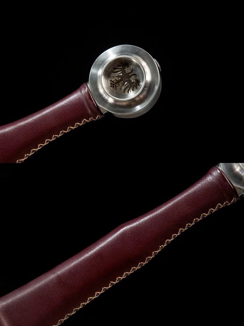 Close-up of the medieval longsword handle showing authentic leather grip and stitching detail.