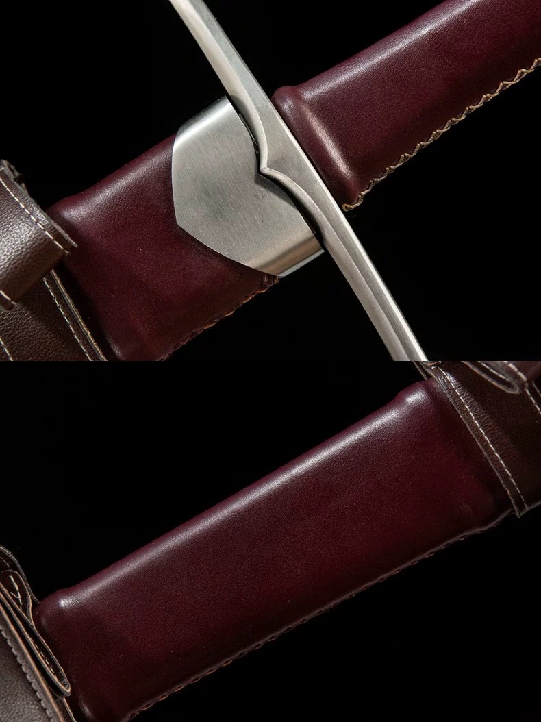 Detailed view of the medieval longsword crossguard and leather-wrapped handle construction.