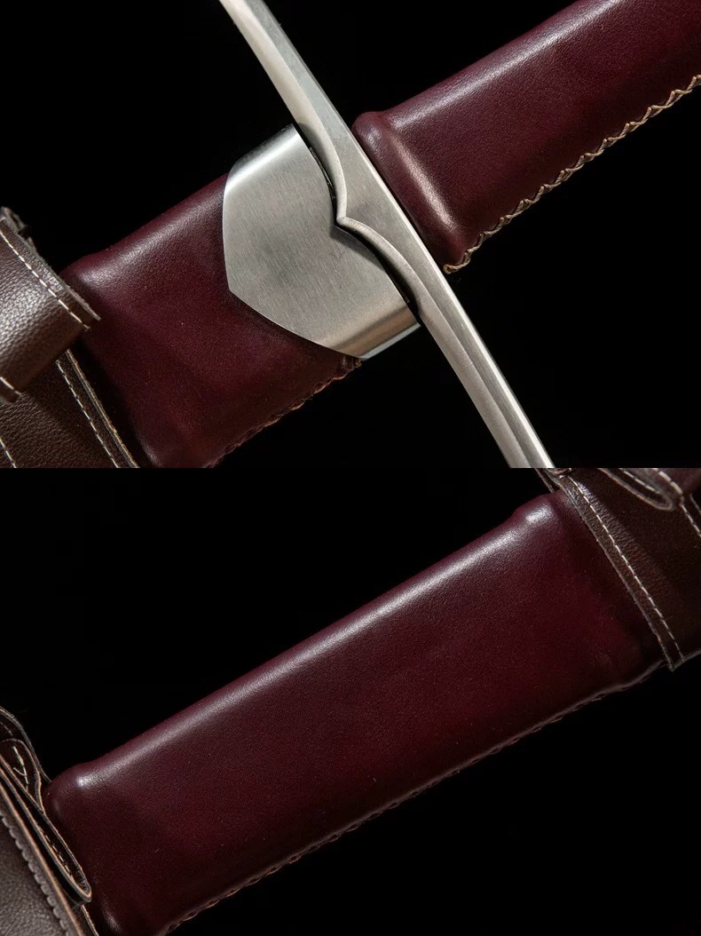 Detailed view of the medieval longsword crossguard and leather-wrapped handle construction.
