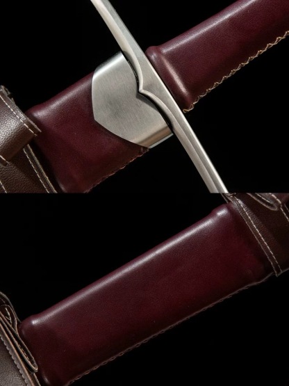 Detailed view of the medieval longsword crossguard and leather-wrapped handle construction.