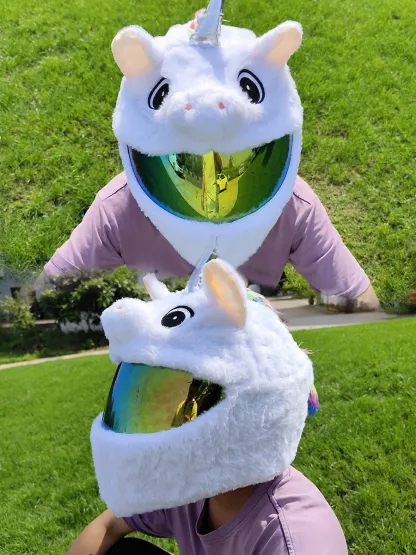Fun and unique unicorn motorcycle helmet cover shown on a rider enjoying the sun.