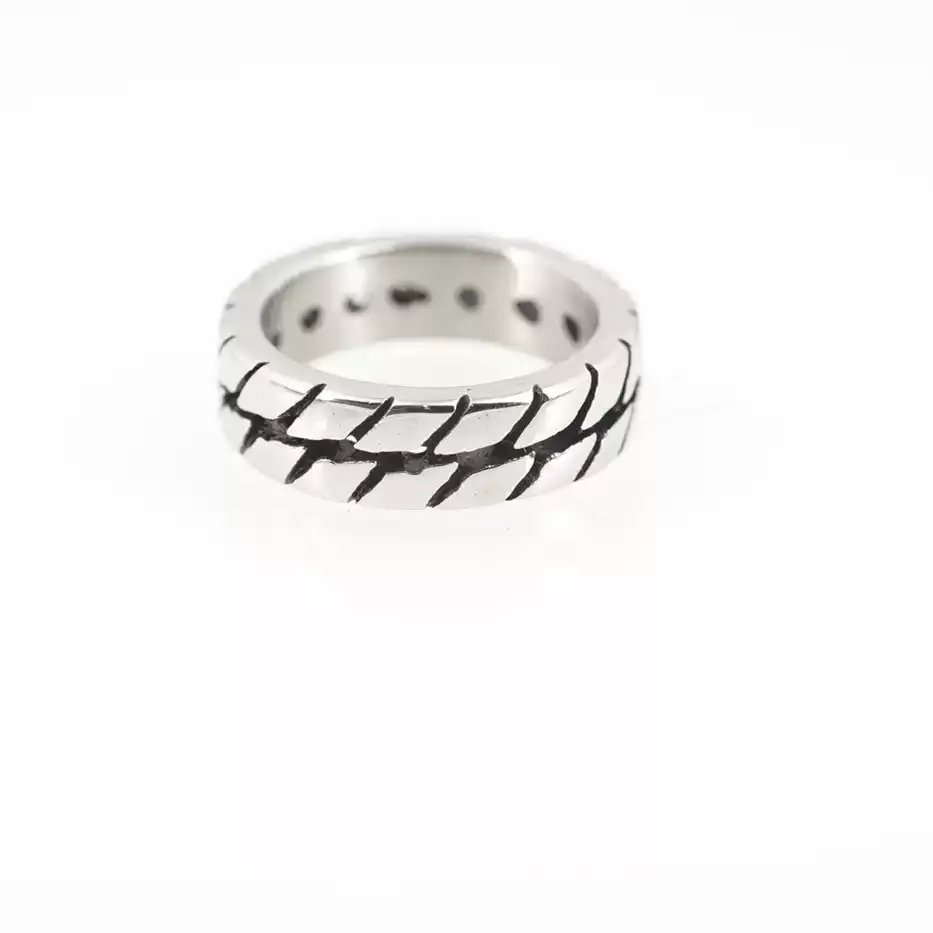 Silver stainless steel motorcycle tire tread ring for men on a clean white background, showcasing the detailed rugged tire pattern design.