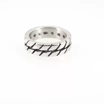 Silver stainless steel motorcycle tire tread ring for men on a clean white background, showcasing the detailed rugged tire pattern design.