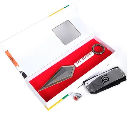 High-angle top-down view of the Naruto kunai and headband set inside the official gift box.