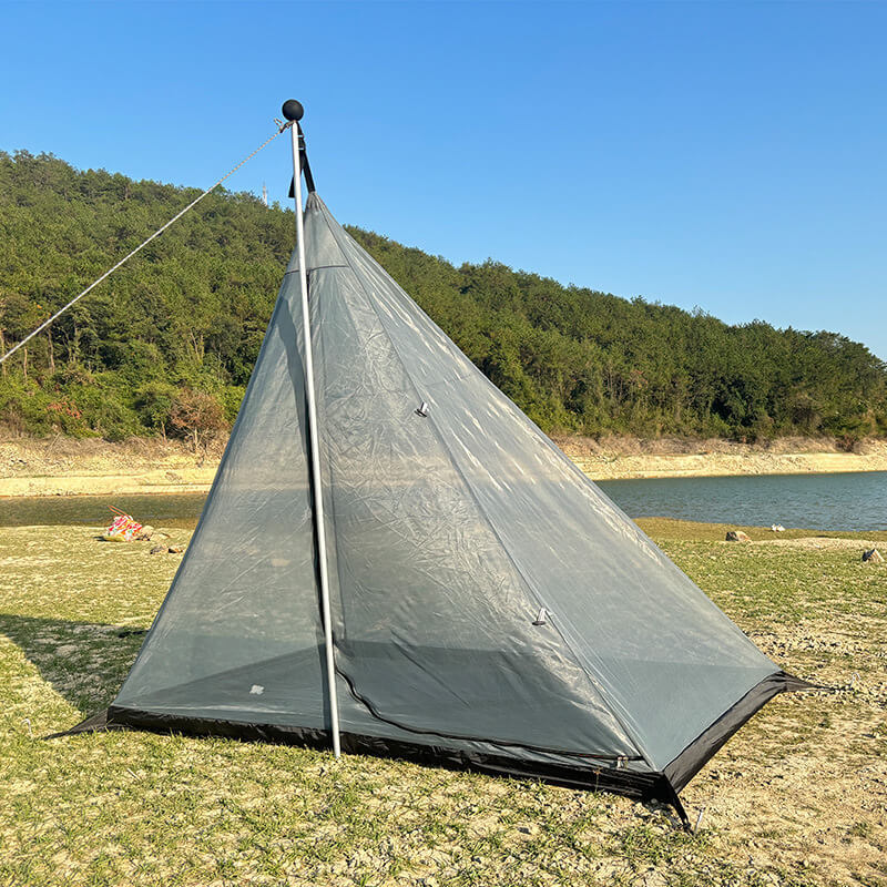 The gray inner mesh tent provides bug protection and ventilation for the pyramid hot tent.