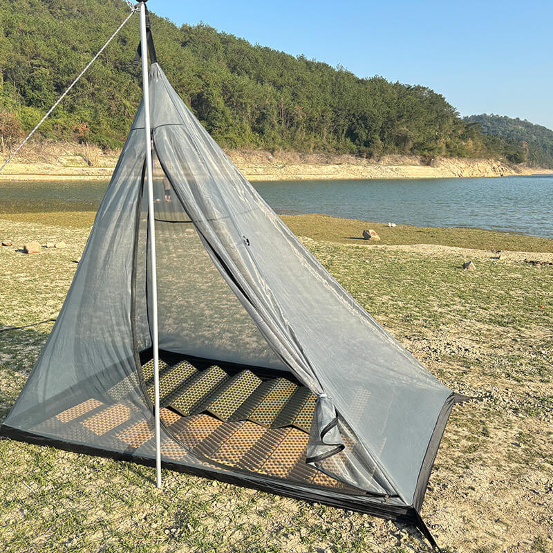 Close-up of the inner mesh tent and floor setup, highlighting the bug-proof protection.
