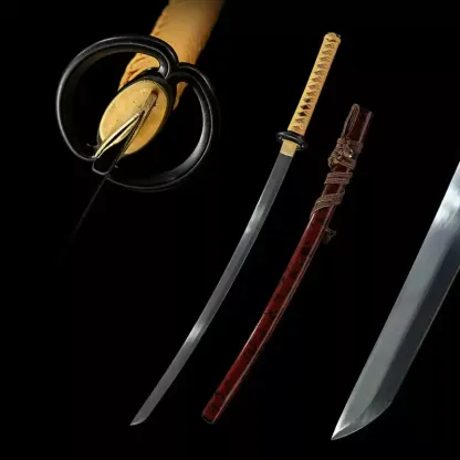 Close-up of a Rurouni Kenshin reverse-blade katana featuring the tsuba handguard and gold-wrapped handle.