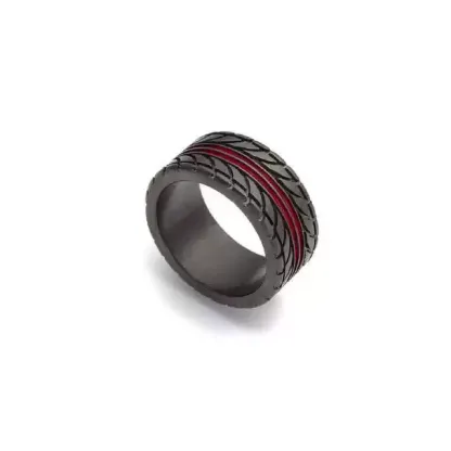An angled close-up view on white background of a black motorcycle tire tread pattern wedding band with a thin red accent line.