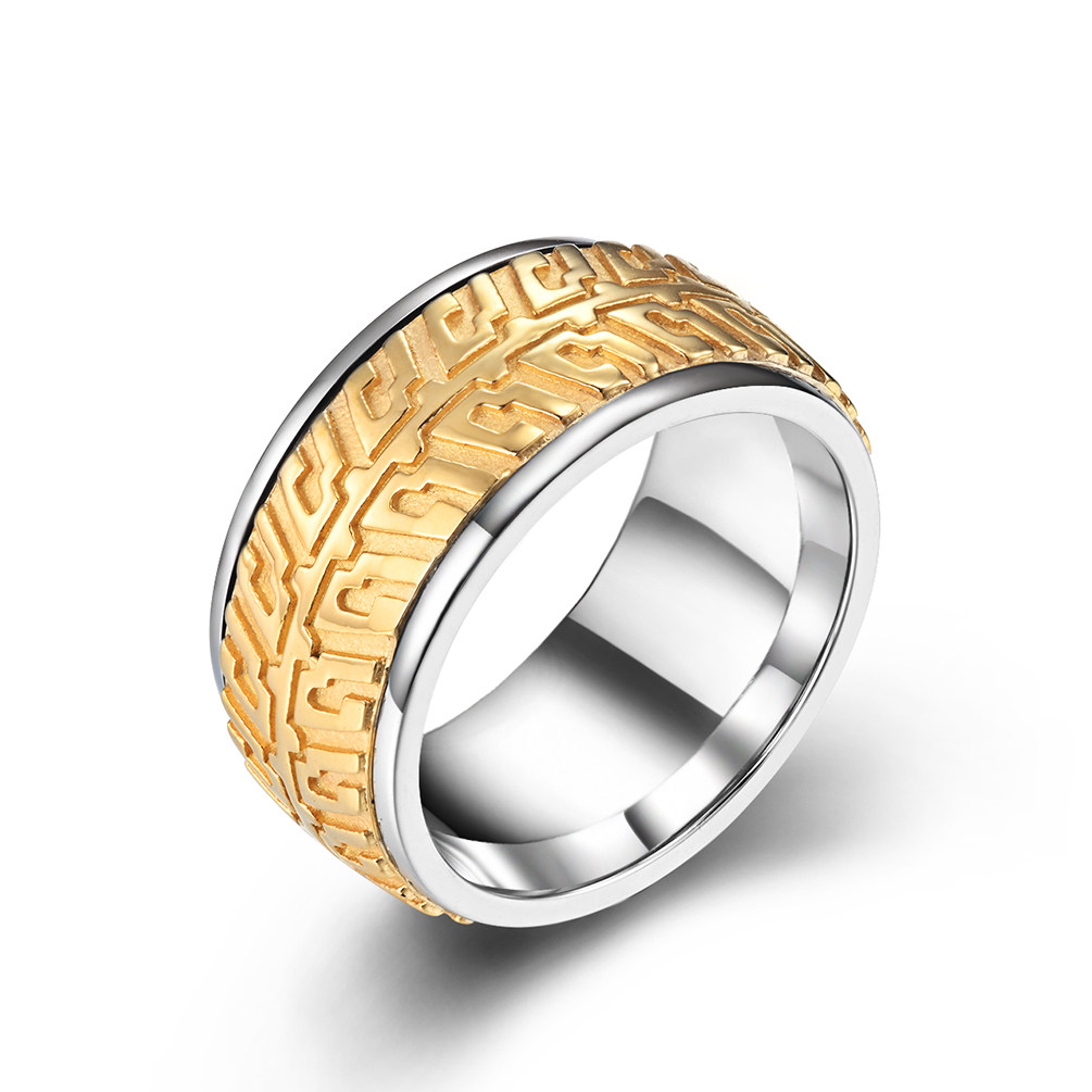 Two-tone gold and silver stainless steel motorcycle tire tread ring with engraved patterns.