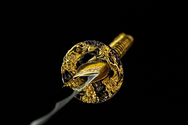 Dual vertical presentation showing two full views of the Gold Dragon Katana, illustrating front and side details.