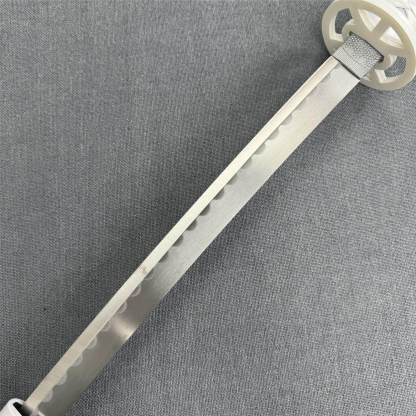 Close-up of the intricate white circular tsuba guard and textured habaki on the Kuchiki Unleashed katana.