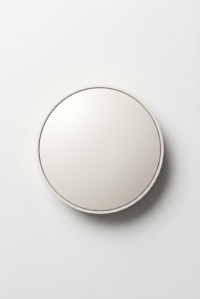 Ivory pressed powder compact on minimalist off-white background