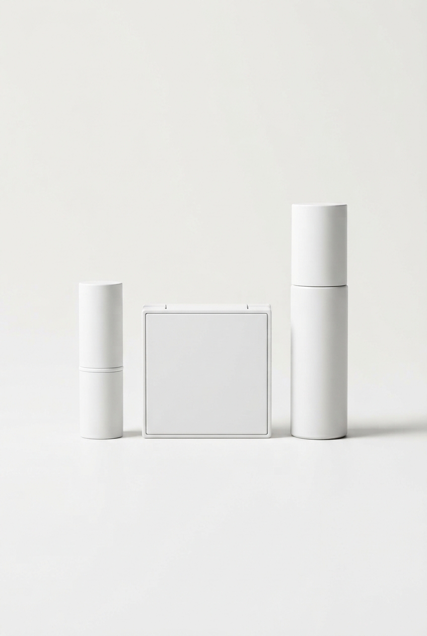 White coordinated makeup set trio on minimalist off-white background