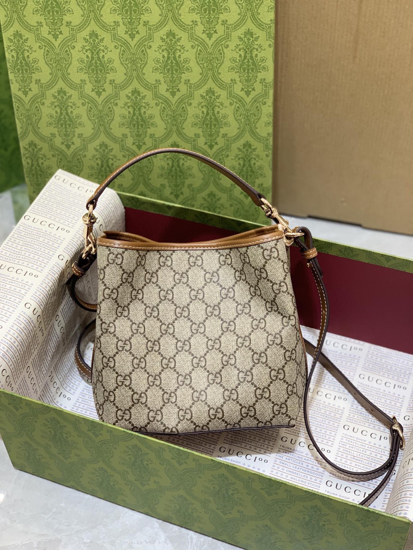 GUCCI GG EMBLEM MINI BUCKER BAG