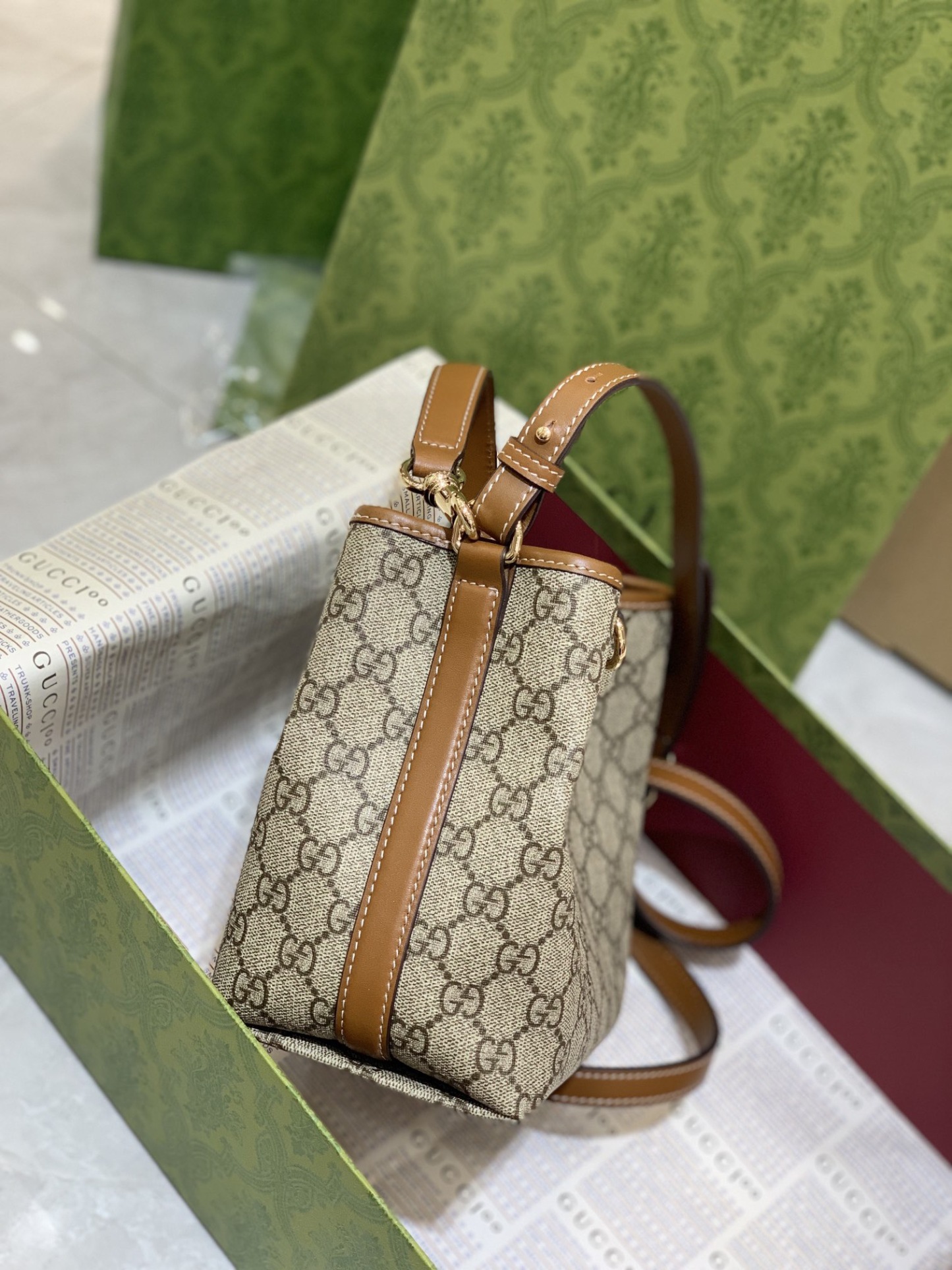 GUCCI GG EMBLEM MINI BUCKER BAG