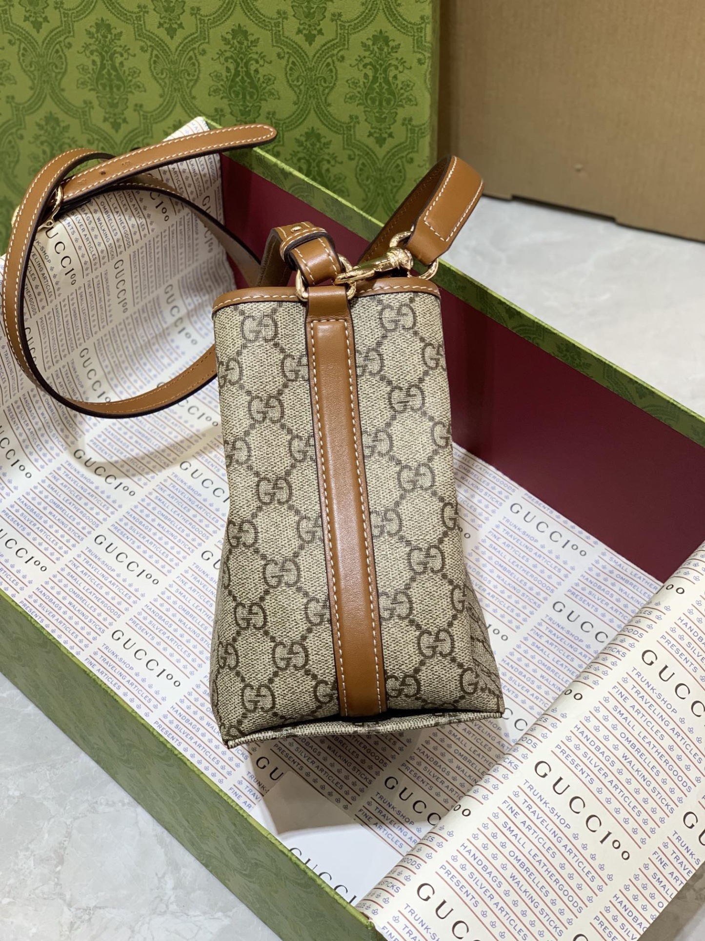 GUCCI GG EMBLEM MINI BUCKER BAG