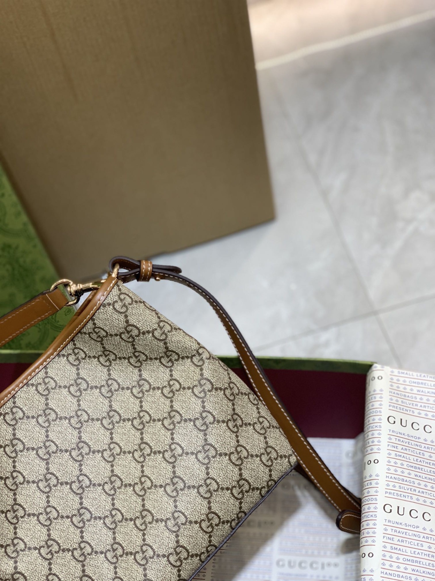 GUCCI GG EMBLEM MINI BUCKER BAG