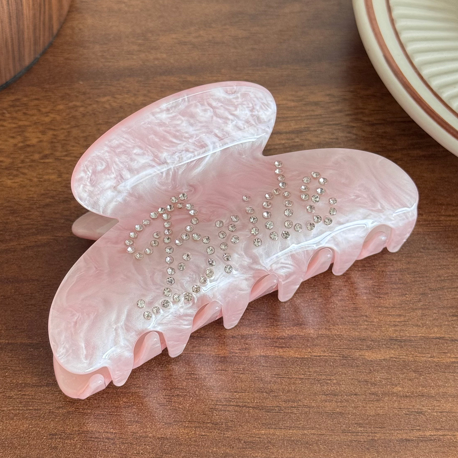 Rhinestone-encrusted acrylic hair clip