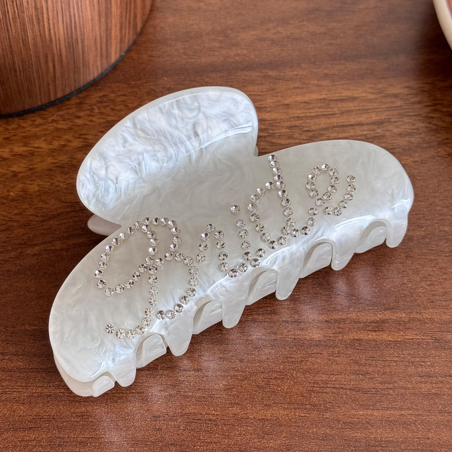 Rhinestone-encrusted acrylic hair clip