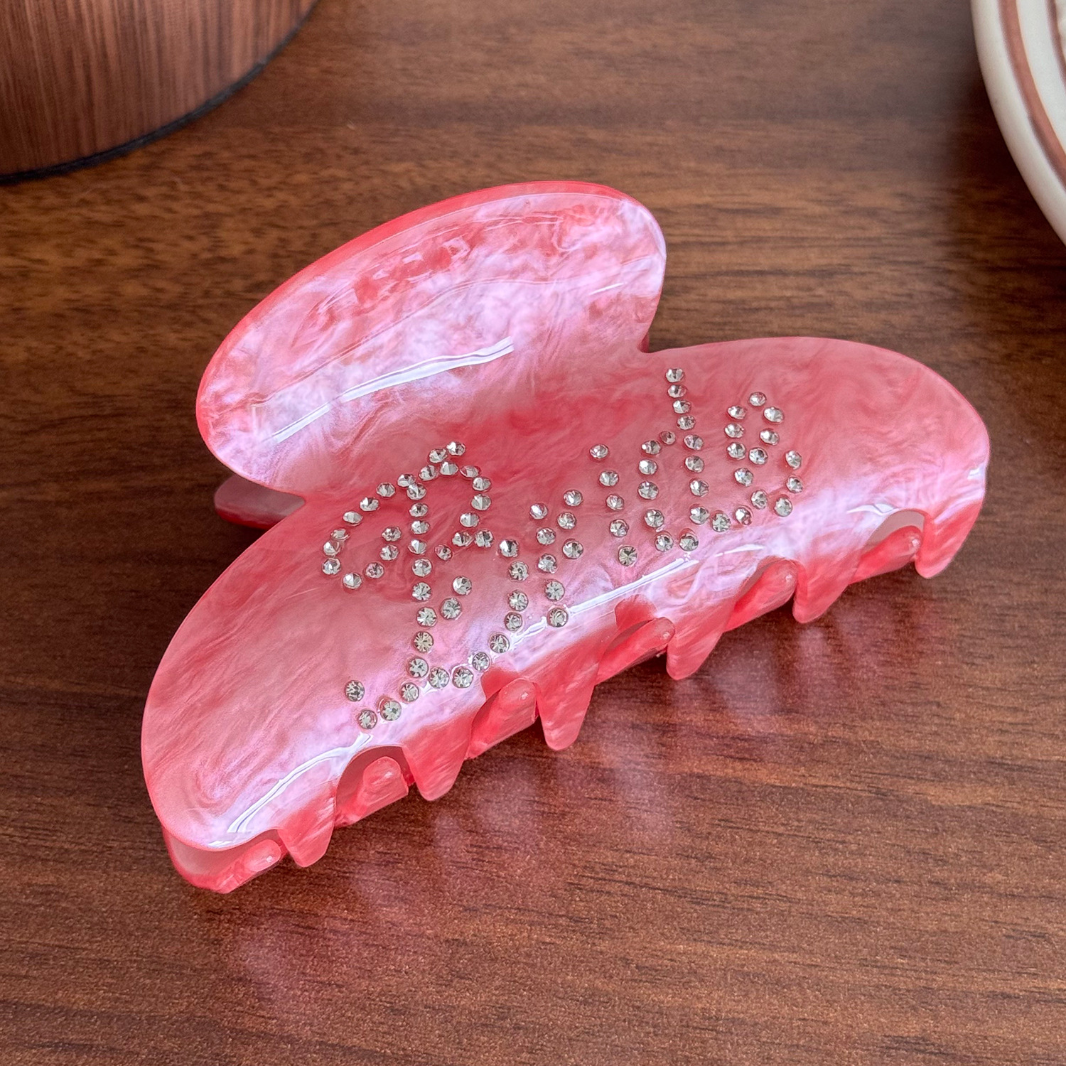 Rhinestone-encrusted acrylic hair clip