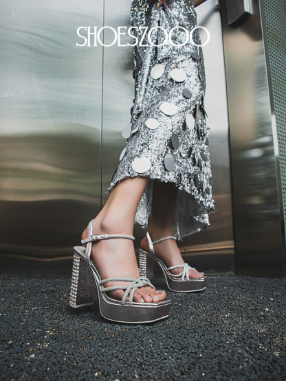 Rhinestone embellished high-heeled sandals.
