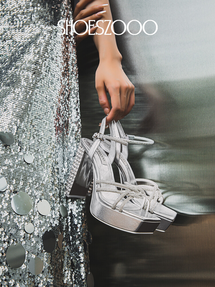 Rhinestone embellished high-heeled sandals.
