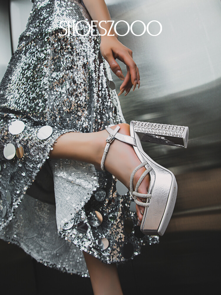 Rhinestone embellished high-heeled sandals.