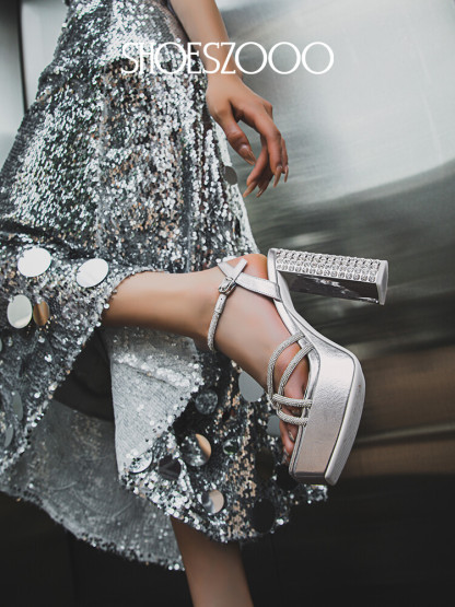 Rhinestone embellished high-heeled sandals.